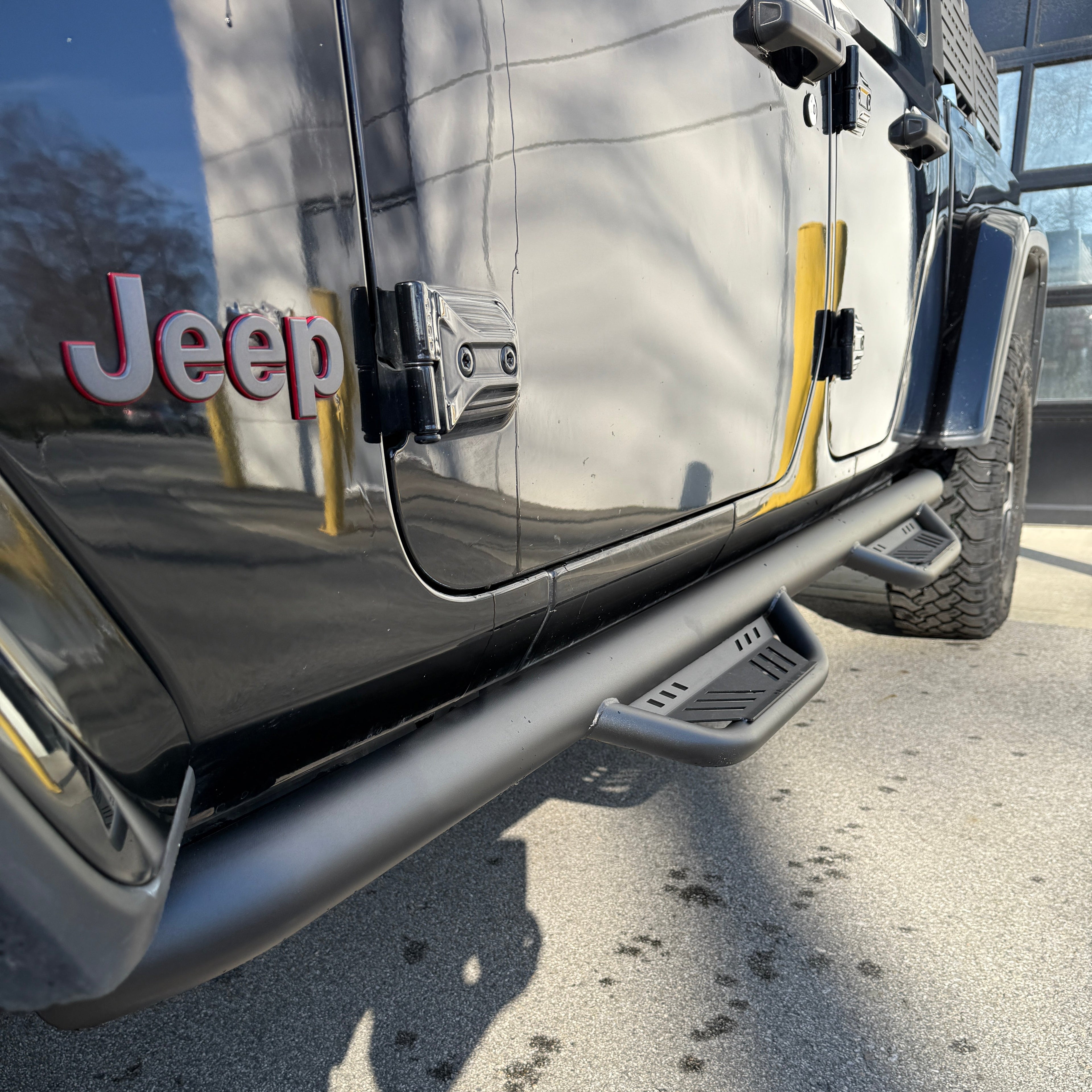 close-up of 2020–2026 Jeep Gladiator JT OE+ side steps installed on vehicle