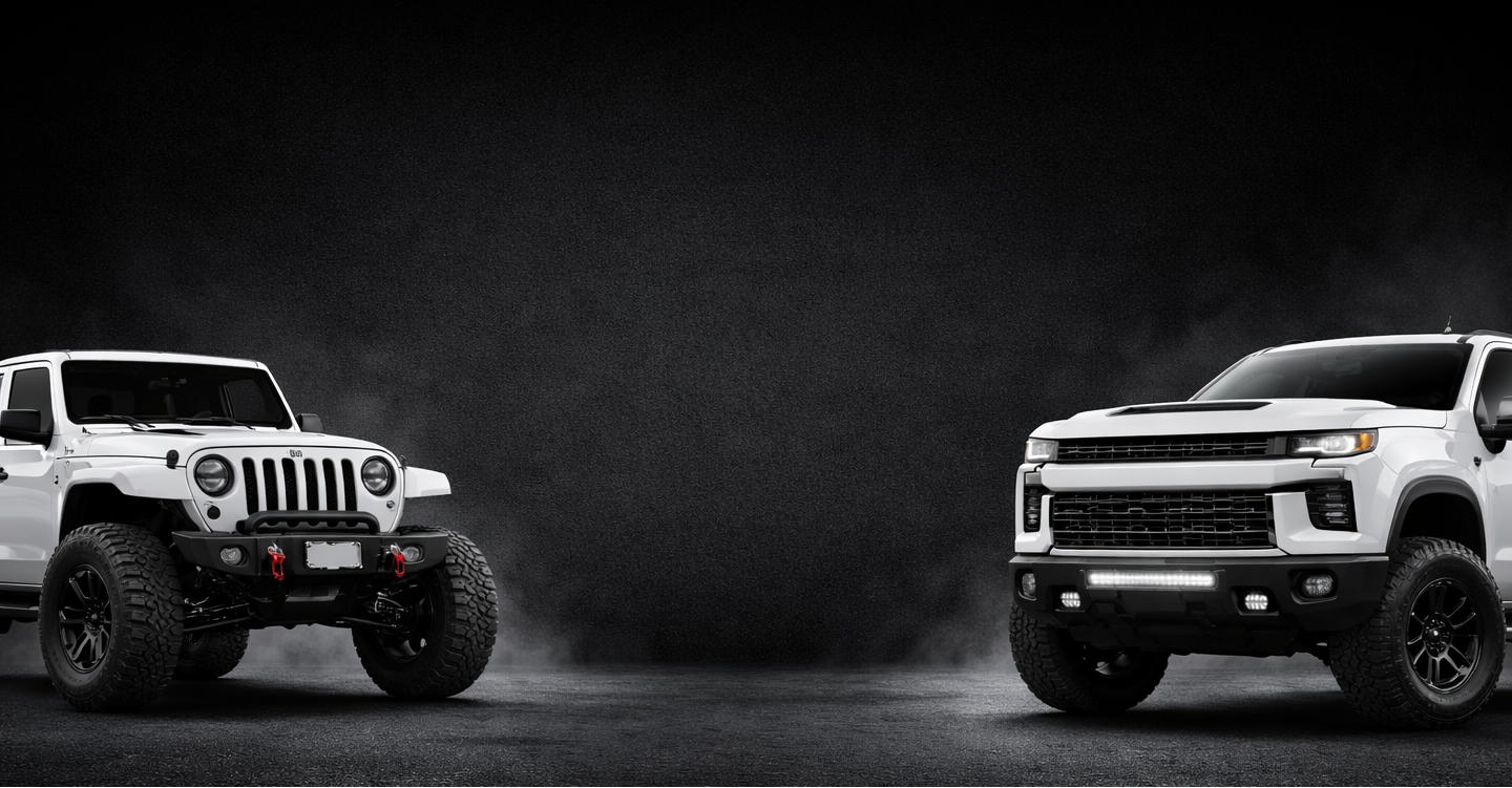 Gary’s Auto Recycling. Two white pickup trucks facing each other on a dark background